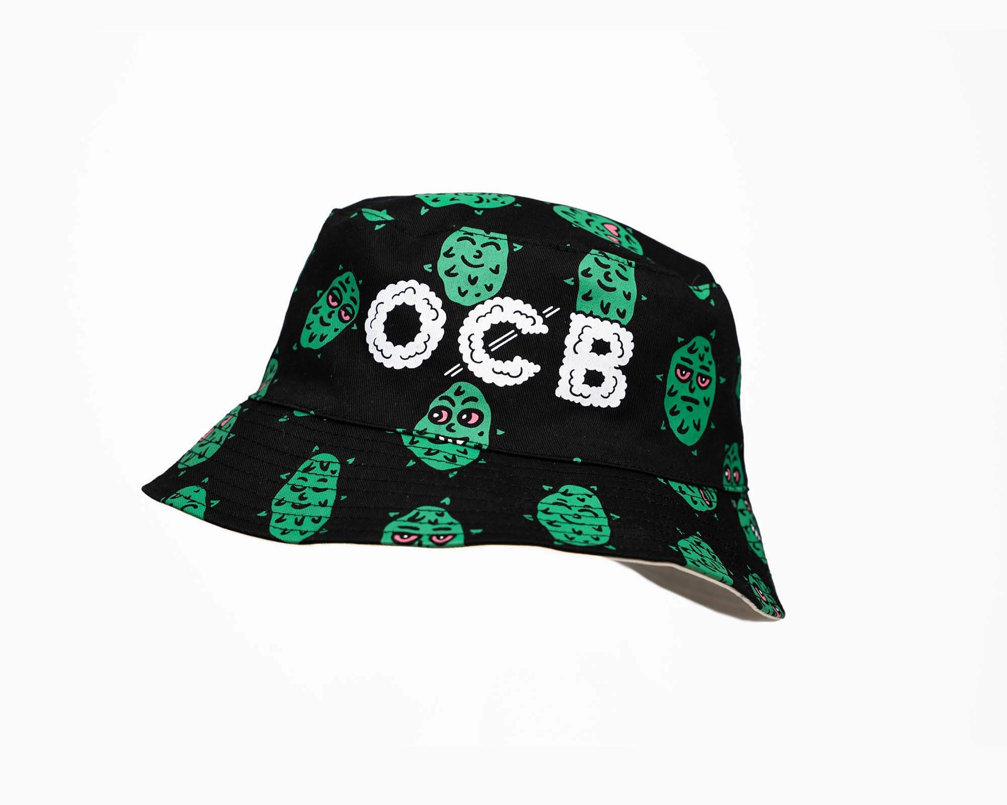 Black bucket hat with green pattern and 'OCB' text on a white background