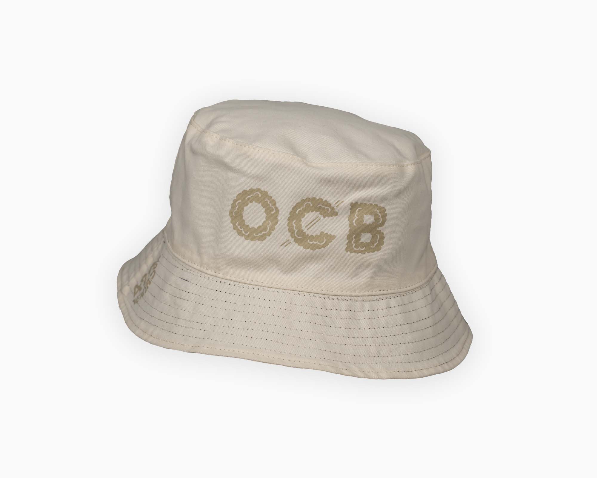 Beige bucket hat with 'OCB' branding on a white background