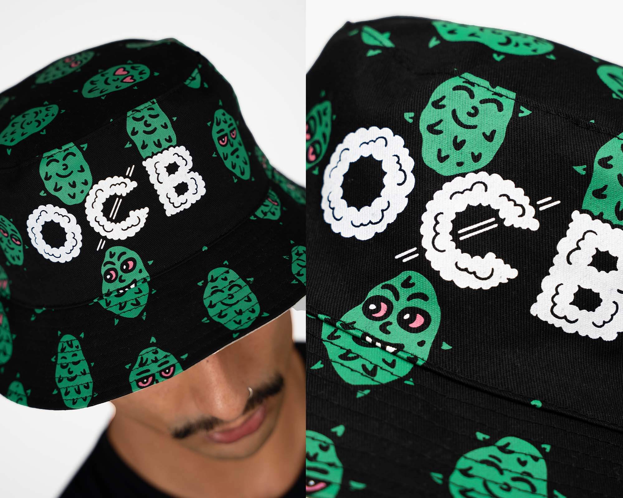 Black cap with green pattern and 'OCB' text, worn by a person.
